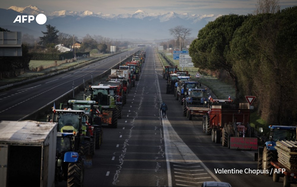 AFP picture by Valentine Chapuis - Farmers block the A64 highway - Carbonne, France 