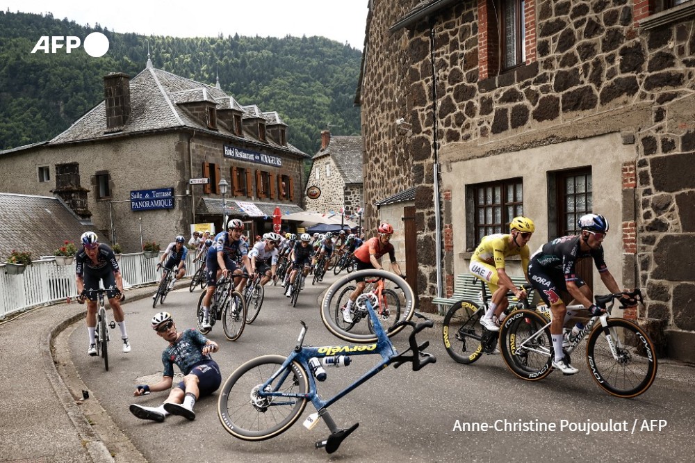 Belgian rider Wout Van Aert crashes in the Col de Neronne ascent during the 11th stage of the 111th edition of the Tour de France cycling race