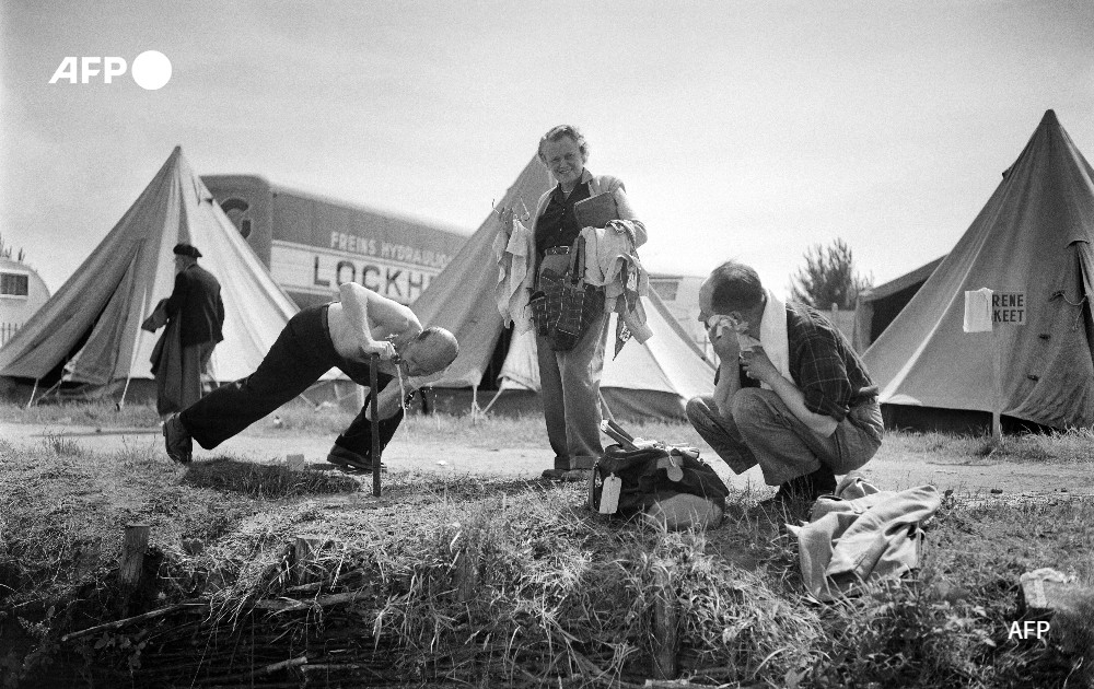 Supporters who camp near the circuit of Le Mans wash up, 1952