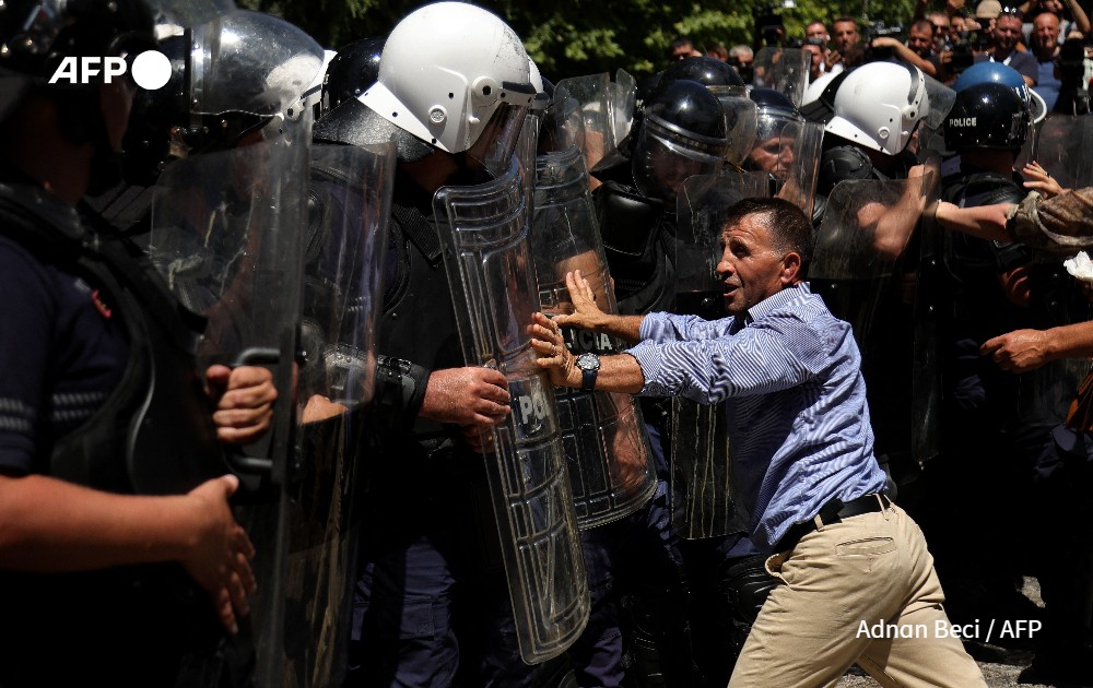 Opposition suporters clash with police during a protest