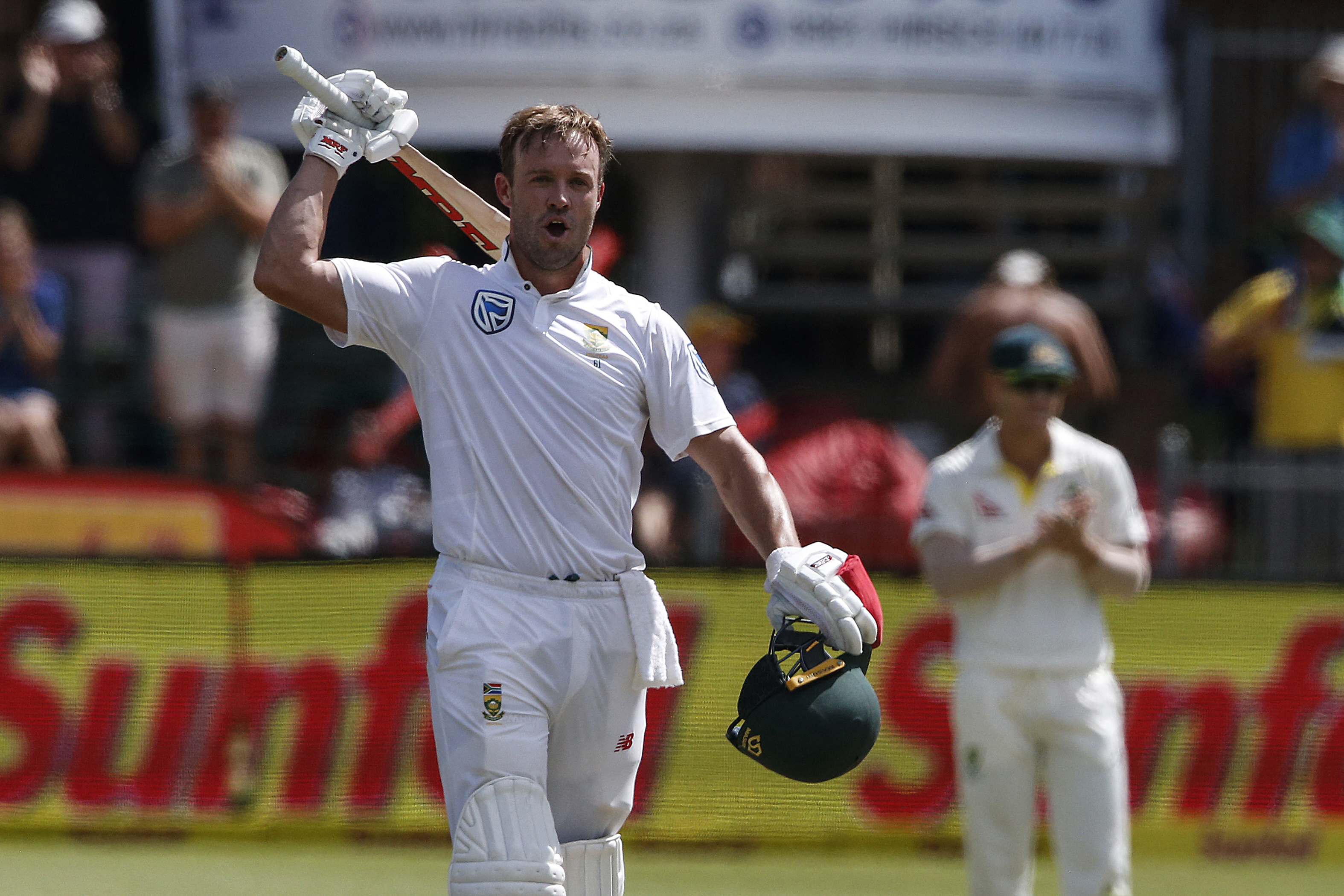 South Africa's batsman AB de Villiers celebrates scoring a century during day three of the second Test cricket match between South Africa and Australia at St George’s Park in Port Elizabeth on March 11, 2018. (Photo by MARCO LONGARI / AFP)