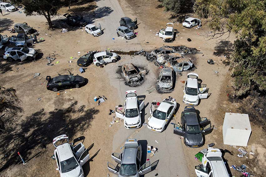 Aerial view, on October 13, 2023, of abandoned or burned vehicles in the Negev Desert, at the site of the rave party attacked on October 7 by Hamas fighters. Photo by Jack Guez / AFP.