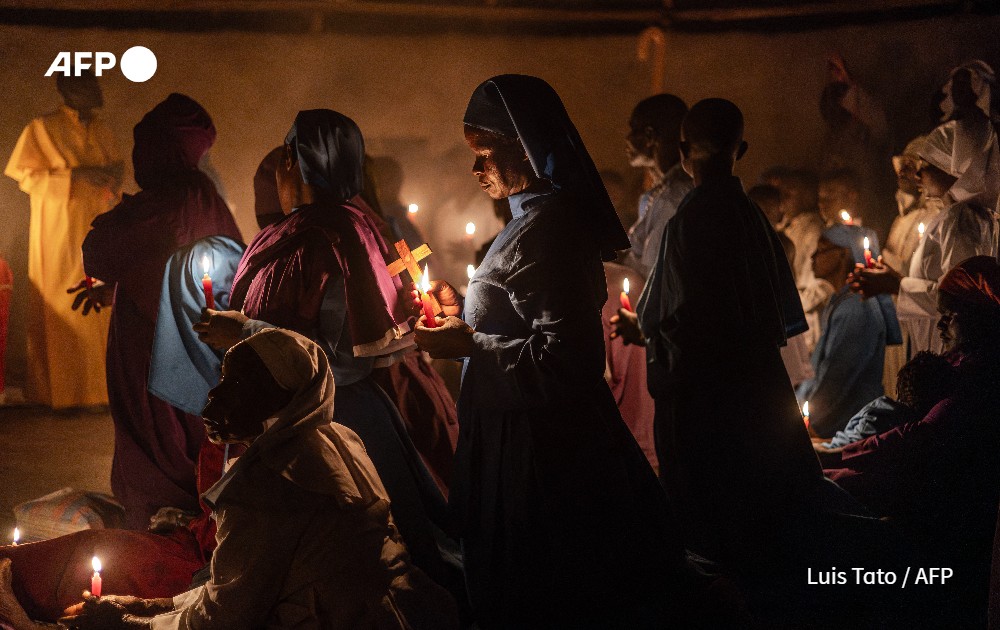 Worshippers gather to pray during the Christmas Eve vigil mass 