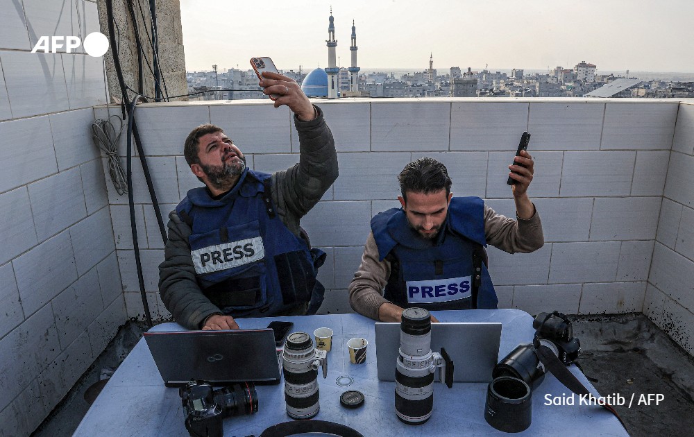 Palestinian journalists attempt to connect to the internet